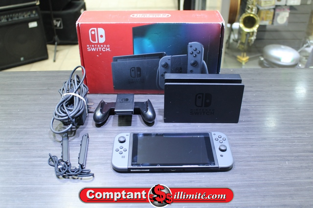 Console Nintendo switch + carte sd 64 go + boite (petite cassure) hac-001